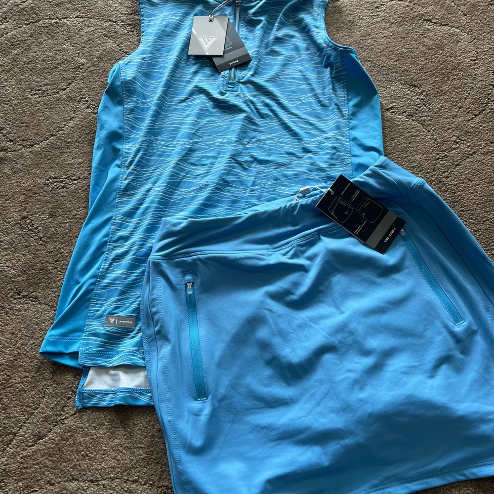 Levelwear set.  NWT shirt sm. matching skirt pockets and shorts extra small